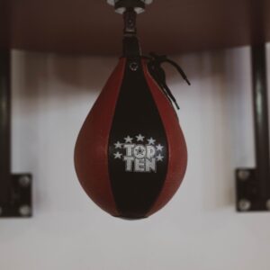 A detailed close-up of a hanging speedbag in a gym, ideal for boxing enthusiasts.