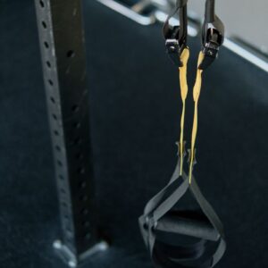 Close-up of a suspension trainer at a gym, perfect for fitness enthusiasts seeking versatile workouts.