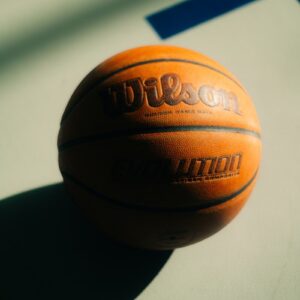 a close up of a basketball on a court